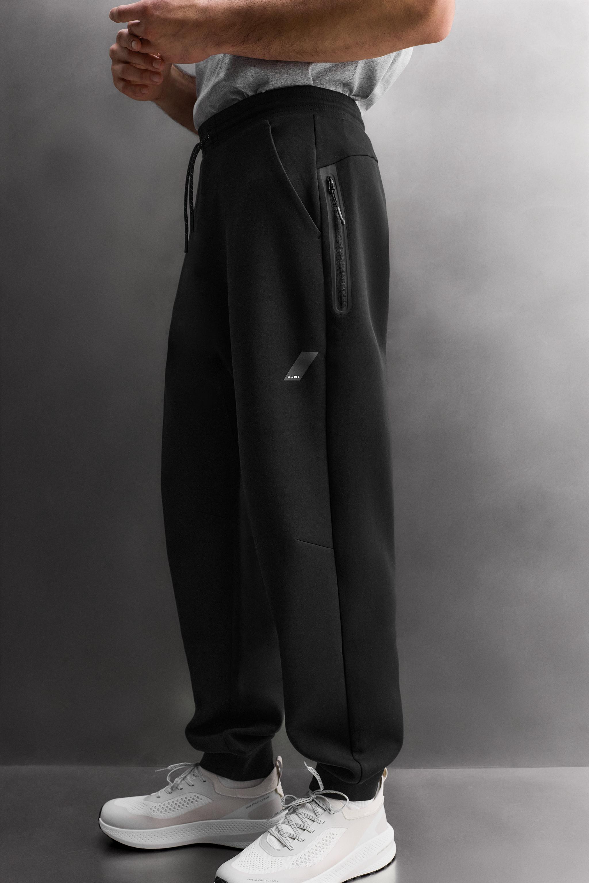 TECHNICAL PANTS WITH ZIPPERS